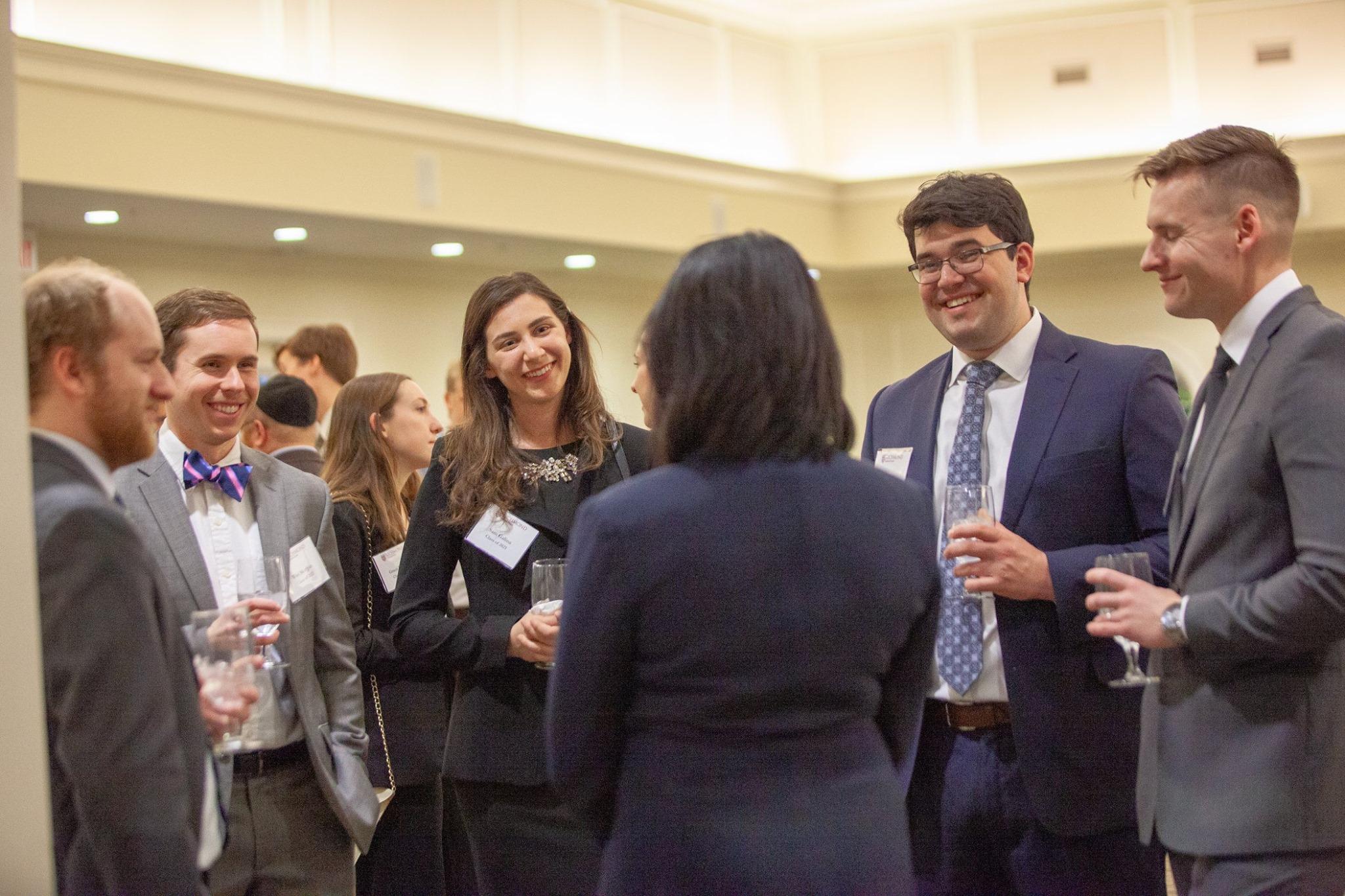 Attorneys networking at a professional gathering